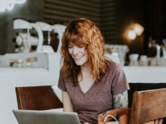 Graduate Assistantships: How to Pay for Your Master’s or Ph.D. Degree Woman studying and working on her laptop