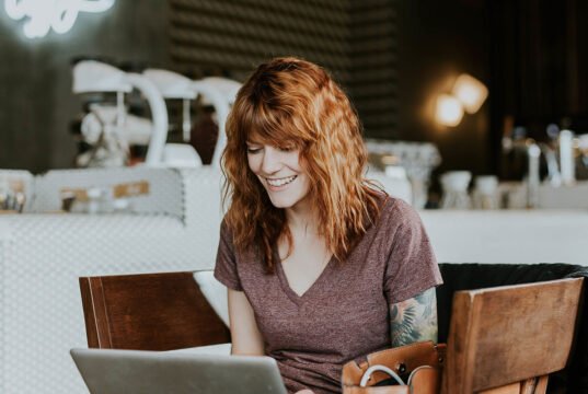 Graduate Assistantships: How to Pay for Your Master’s or Ph.D. Degree Woman studying and working on her laptop